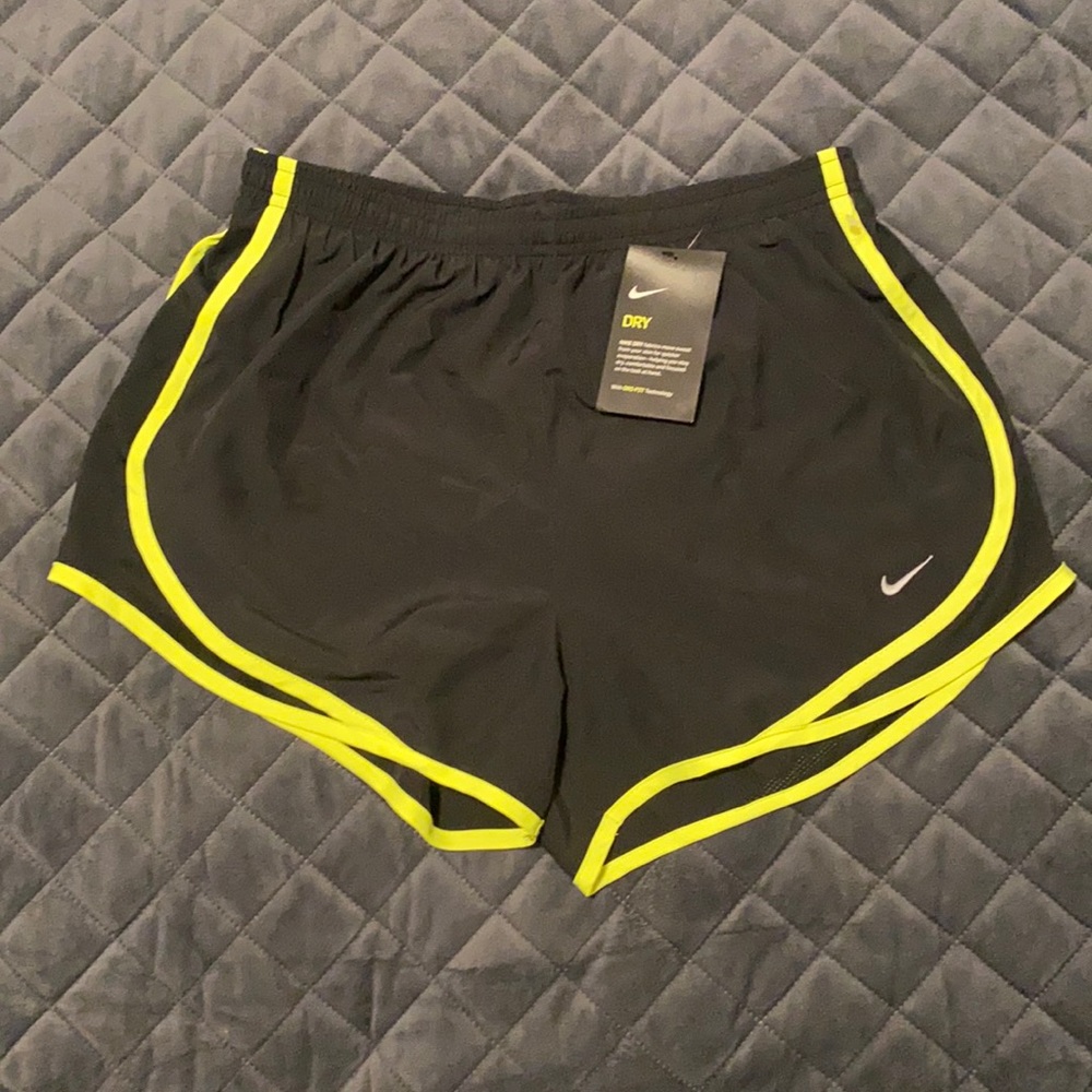 Women’s Nike size M black athletic shorts w neon yellow trim, NWT
